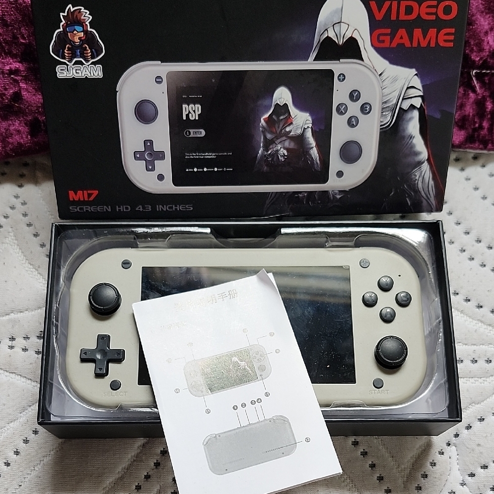 Gray Handheld Console with Wide Screen and Sleek Design